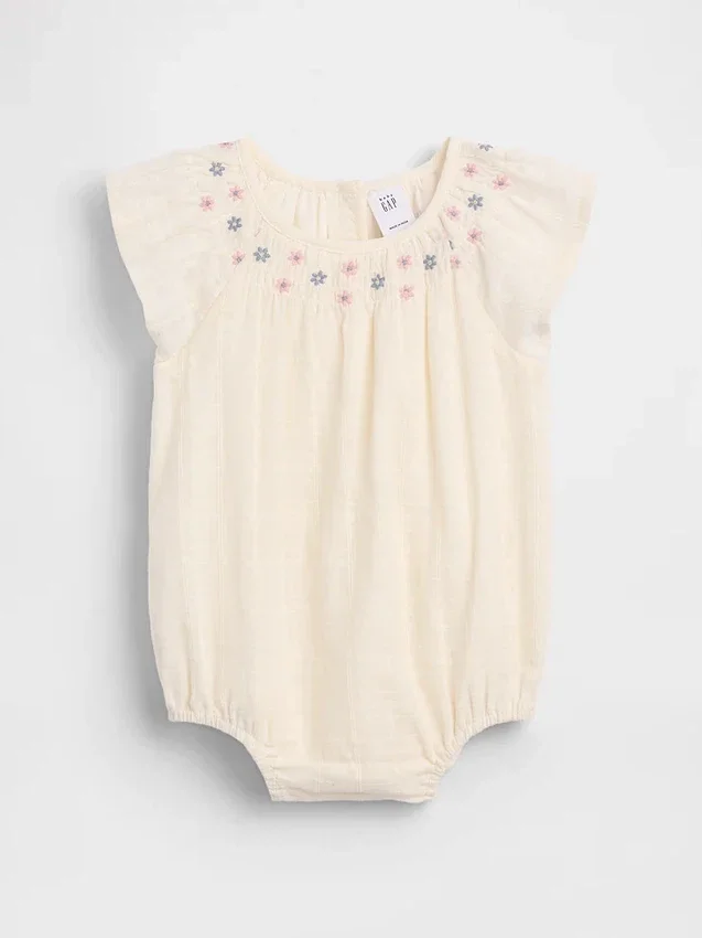 Baby-body med smock og blomstermønster