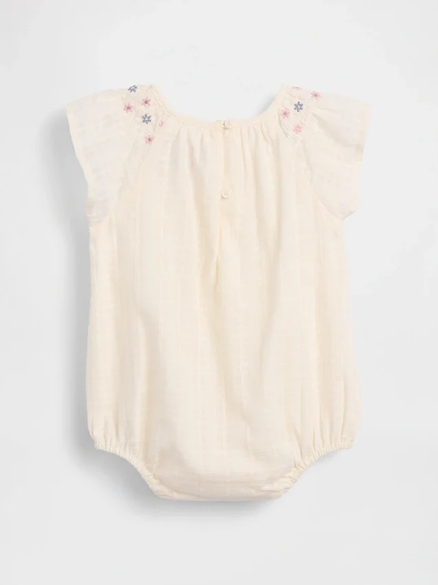 Baby-body med smock og blomstermønster
