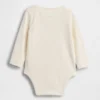 Baby First Favorites body i økologisk bomull med NYC-logo på lommen