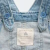 Baby-overalls i denim med brodert blomstermønster