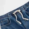 Baggy-Jeans i strikket denim med middels høy midje