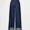 Baggy-jeans med middels høy midje og metalliske mansjetter
