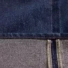 Baggy-jeans med middels høy midje og metalliske mansjetter