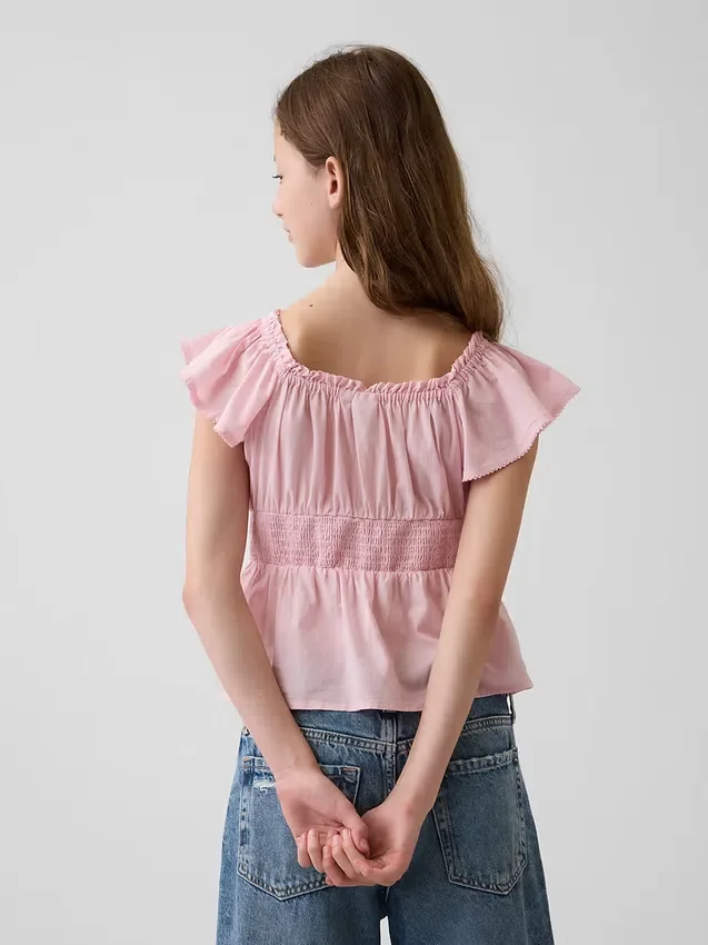 Barnebluse med flagrende ermer og knapper foran