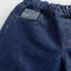 Barnesjeans med lav midje, løs passform og metallisk glans