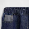 Barnesjeans med lav midje, løs passform og metallisk glans