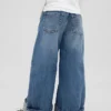 Barnesjeans med lav midje, vid ben og løs passform