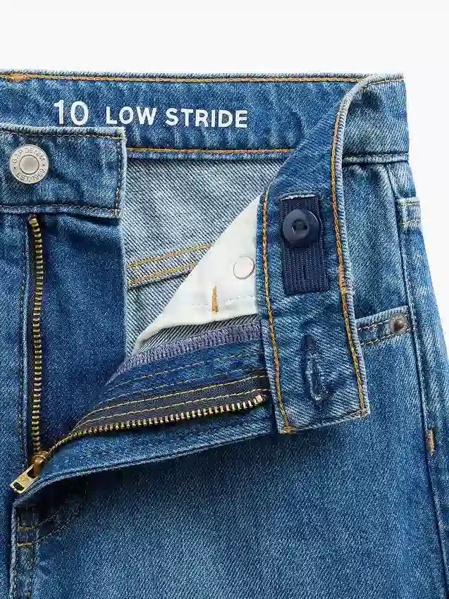 Barnjeans med lav midje, bred benvidde og brodert blomstermønster