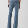 Capri-jeans med lav midje, lang og slank passform og påsydde lommer
