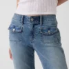 Capri-jeans med lav midje, lang og slank passform og påsydde lommer