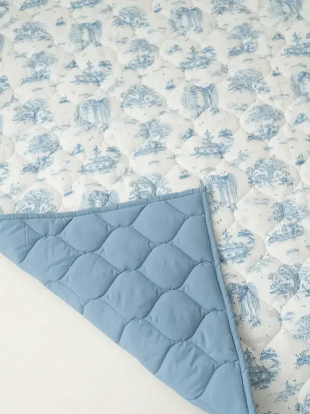 Det forgyllede fugle-leketeppet «Spring Toile»