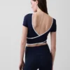 GapFit Smooth vendbar crop-top med kryssrygg