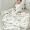 Gilded Bird Safari Toile-babytæppe i bambus