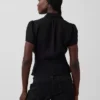 Gjennomsiktig peplum-top med knapper foran