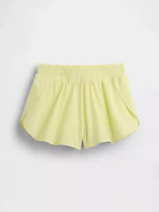 Hurtigtørkende løpeshorts med sommerfuglkant for barn