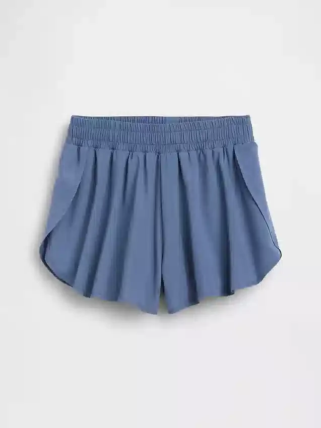 Hurtigtørkende løpeshorts med sommerfuglkant for barn