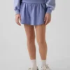 Hurtigtørkende løpeshorts med sommerfuglkant for barn