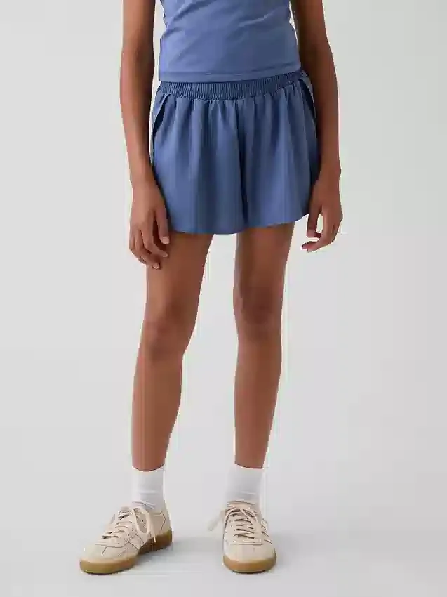 Hurtigtørkende løpeshorts med sommerfuglkant for barn