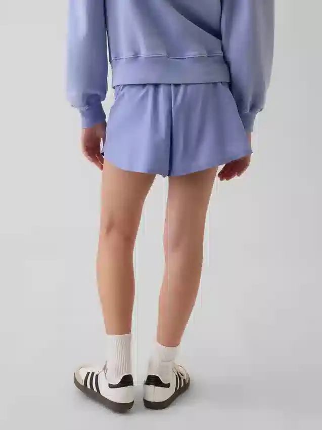 Hurtigtørkende løpeshorts med sommerfuglkant for barn