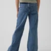 Jeans for barn med lav midje, sømmer og avslappet flare-passform