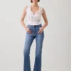 Jeans med høy midje og utvidet ben i 70-tallsstil