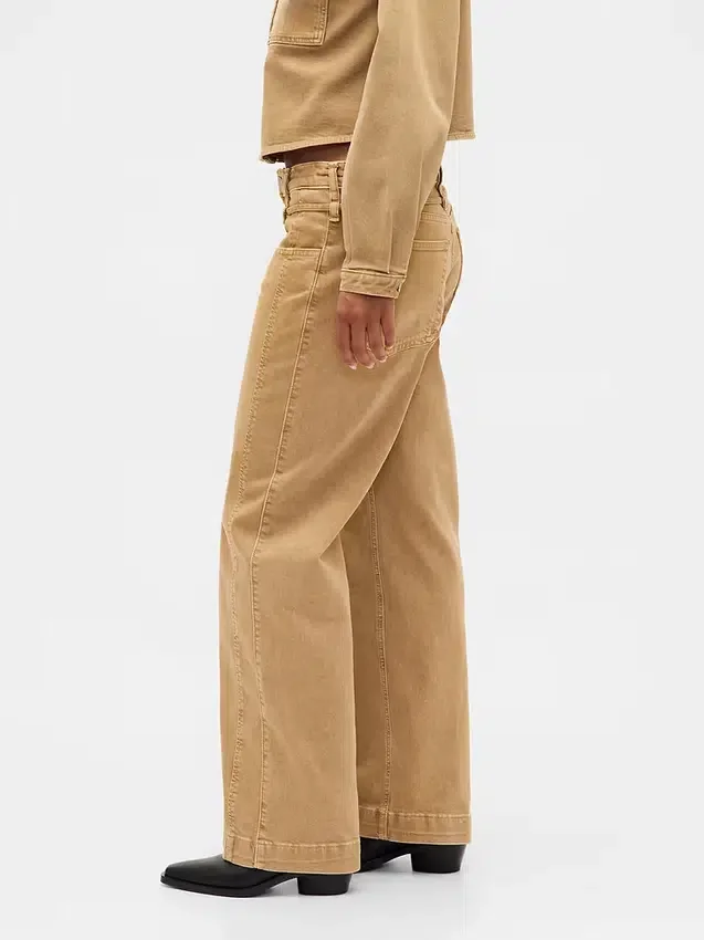 Jeans med lav midje, løs passform og mikrobelte i 90-tallsstil