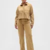 Jeans med lav midje, løs passform og mikrobelte i 90-tallsstil