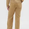 Jeans med lav midje, løs passform og mikrobelte i 90-tallsstil