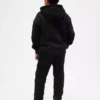 Joggebukse for barn med avslappet passform og sherpa-fôr