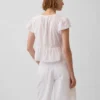 Kort peplum-top i blonder og voile