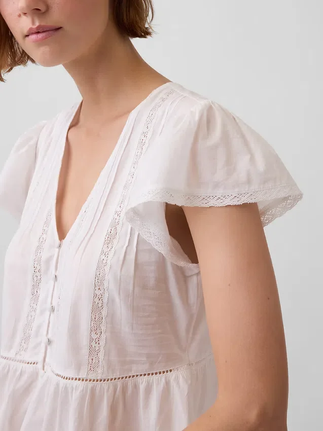 Kort peplum-top i blonder og voile
