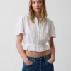 Kort peplum-top i bomullsgasbind