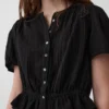 Kort peplum-top i bomullsgasbind