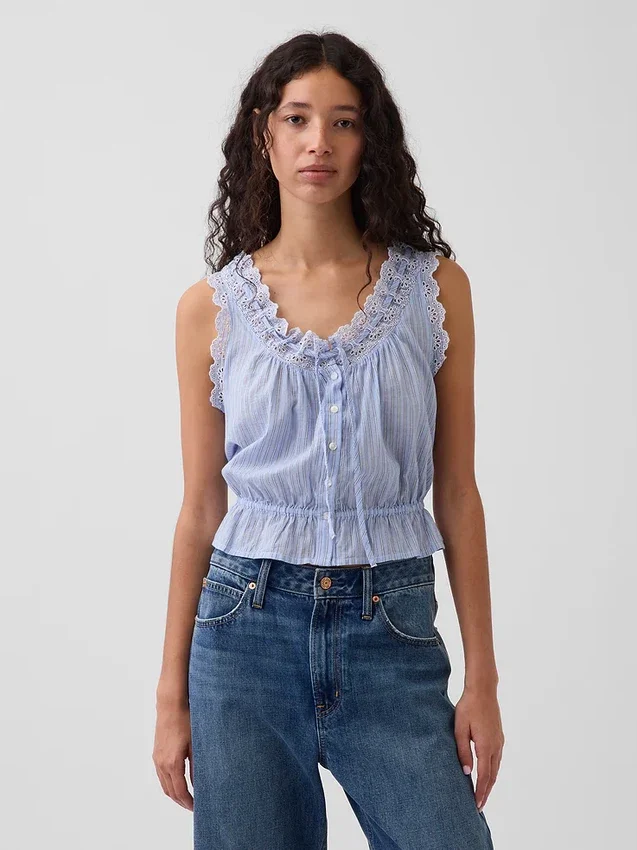 Kort peplum-top med bånd i fronten og hullkant
