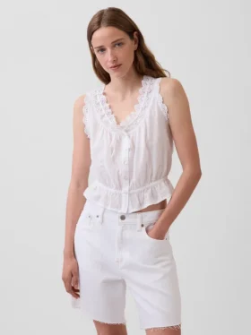 Kort peplum-top med bånd i fronten og hullkant