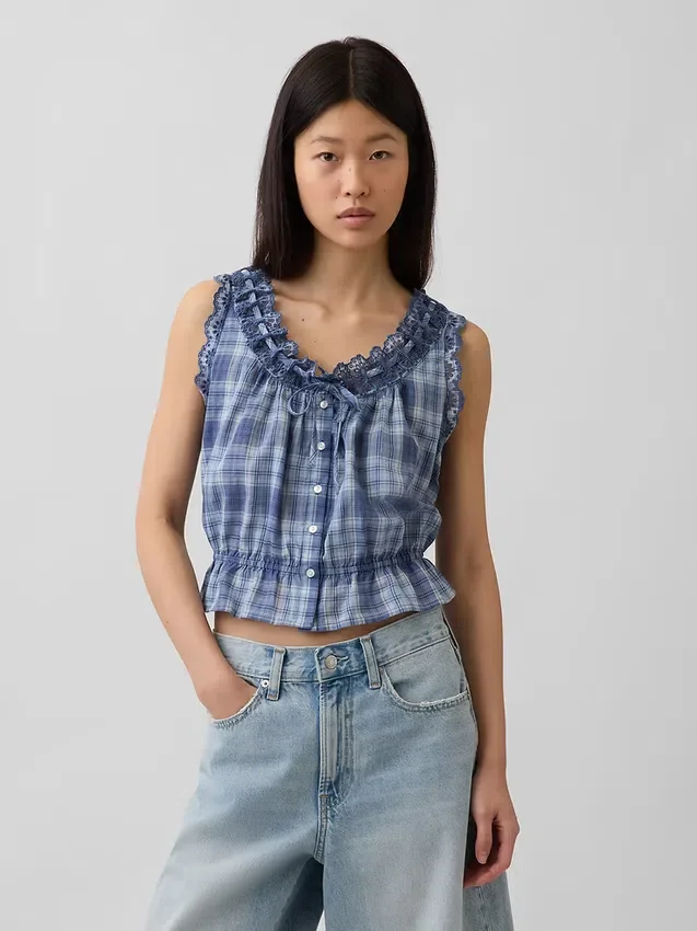 Kort peplum-top med bånd i fronten og hullkant