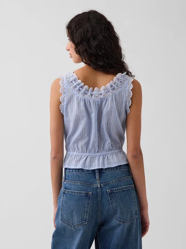 Kort peplum-top med bånd i fronten og hullkant