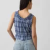 Kort peplum-top med bånd i fronten og hullkant