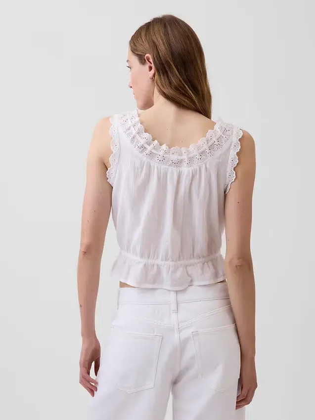 Kort peplum-top med bånd i fronten og hullkant