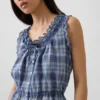 Kort peplum-top med bånd i fronten og hullkant