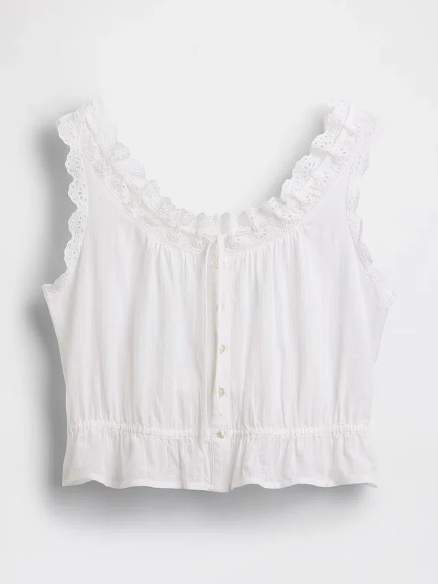 Kort peplum-top med bånd i fronten og hullkant