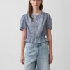 Kort peplum-top med knapper foran