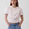 Kort peplum-top med knapper foran