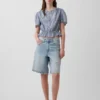 Kort peplum-top med knapper foran