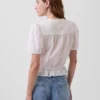 Kort peplum-top med knapper foran