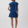 Mini-skort i bomullsgasdenim med smocket midje