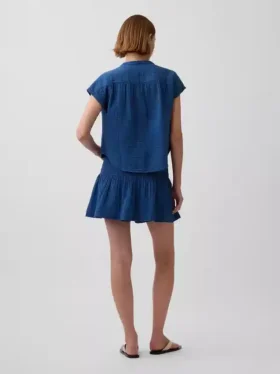 Mini-skort i bomullsgasdenim med smocket midje