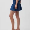 Mini-skort i bomullsgasdenim med smocket midje