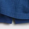 Mini-skort i bomullsgasdenim med smocket midje