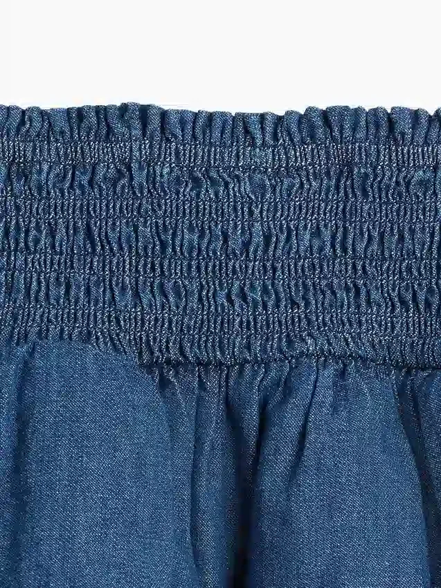 Mini-skort i denim med smocking for barn